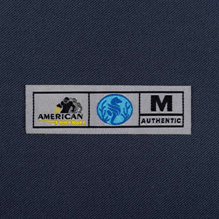 Woven Authenticity tag laid flat