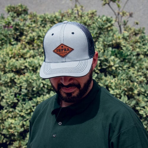 Man Wearing Faux Leather Supra Patch Applied to Baseball Cap