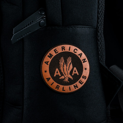 Genuine Leather American Airlines Patch Applied to a Black Backpack